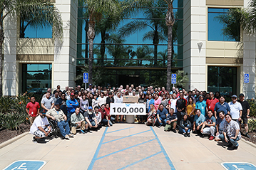 employees in front of TAPI office building